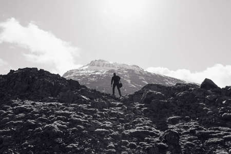 mountains, rocks, guy, man, people, peaks, cliffs, sky, black and white, adventure, hiking