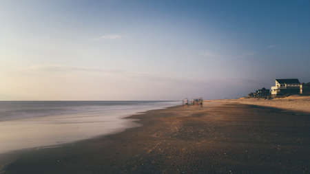beach, sand, shore, water, ocean, sea, horizon, blue, sky, summer, houses, people