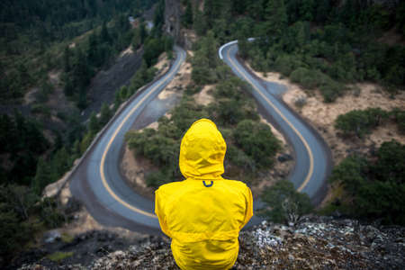 yellow, jacket, rain coat, people, rural, winding, road, hairpin, countryside, cliff, nature, trees