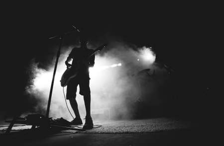 guy, man, male, people, stand, light, shadow, silhouette, spotlight, lighting, smoke, stage, mic,...