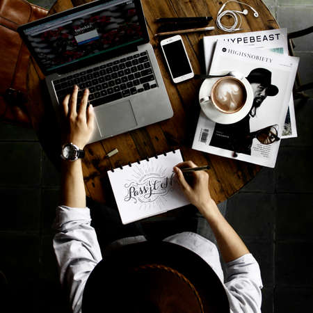 laptop, computer, notebook, pen, writing, coffee, cup, saucer, magazine, phone, earphone, watch,...