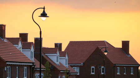 house, wall, bricks, window, village, light, bulb, pole, sky, sunset, sunrise, orange