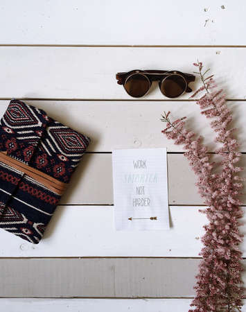 eyeglasses, wallet, flower, paper, quote
