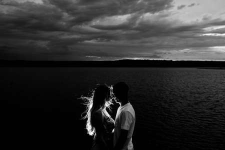 dark, clouds, sky, black and white, people, couple, kiss, hug, love, mountain, sea, ocean, water,...