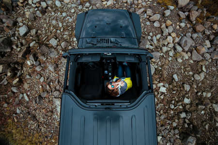 car, vehicle, people, woman, ride, adventure, travel, trip, rocks, grass, land