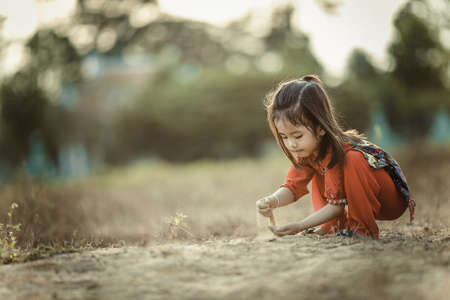 people, girl, child, kid, alone, grass, playing, sand, bokeh
