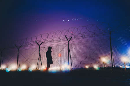 dark, night, sky, lights, wire, fence, people, man,  alone, silhouette