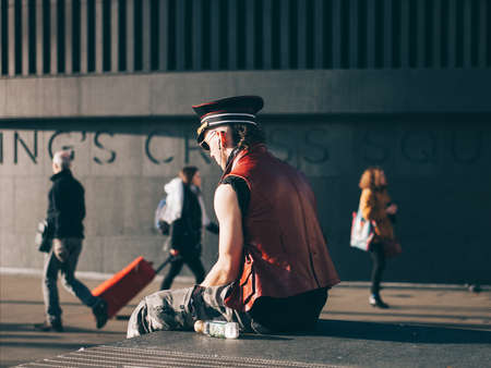 people, men, sitting, walking, travel, rest, sunny, day, wall, road, street, woman, blur