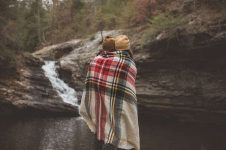 waterfall, water, rock, trees, plant, outdoor, nature, people, couple, shawl, beanie, cold, weather