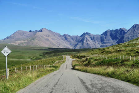 green, grass, fence, sign, road, mountain, highland, blue, sky, outdoor, nature