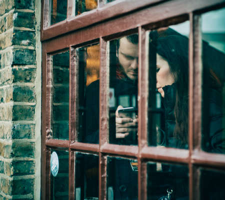 window, glass, couple, mobile, love, texting, phone, people, apple, iphone, brick, man, woman, girl,...