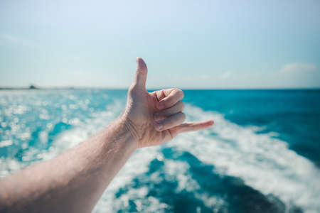 sea, ocean, blue, water, nature, wave, horizon, hand, arm, sky, cloud