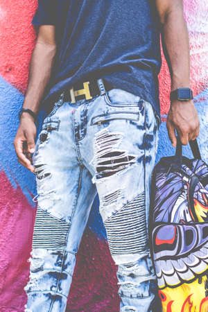 guy, man, fashion, ripped, jeans, colorful, wall, graffiti, art, belt, hermes, watch, bag, african...
