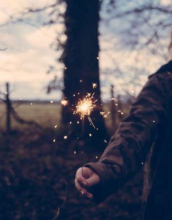 spark, people, fire, light, trees, nature, woman, hand