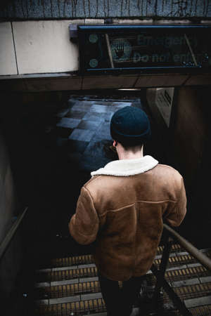 beanie, back, guy, man, people, stairs, floor, checkered, leather, jacket, brown, steel, dark