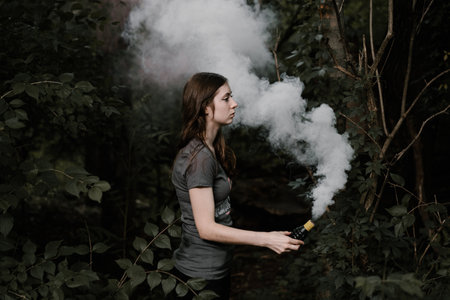 people, women, lady, hand, bottle, smoke, gas, trees, forest, nature, leaves, branches, white, green