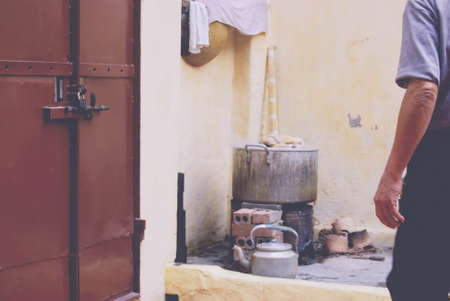 people, man, chef, fireplace, teapots, cook, damage, bricks, fire, heat, pots, towel, food, window,...