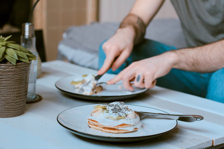 people, man, table, wooden, guy, vase, basket, plants, bonsai, plates, hot cake, breakfast, eat,...