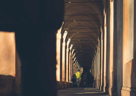 people, man, alone, architecture, building, establishment, sun, shadow, pillar