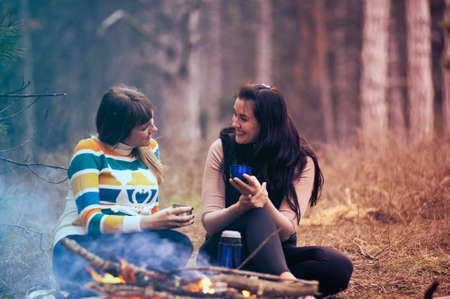 women, girls, talking, smile, happy, friendship, sitting, trees, bokeh, fire, drinks