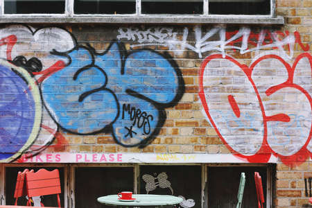 wall, bricks, paint, vandal, art, letters, table, chairs, cup, empty, graffiti