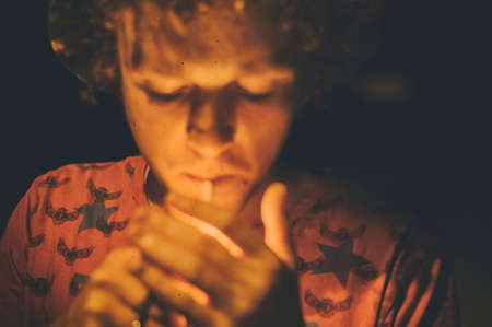 people, boy, guy, man, light, fire, smoking, cigarette