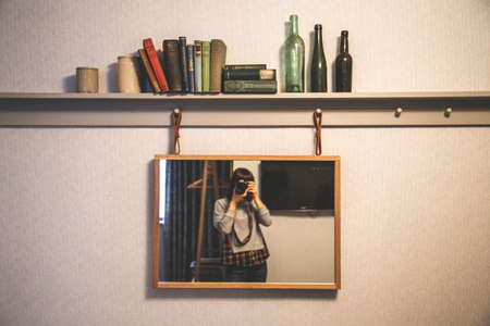 people, woman, frame, camera, shutter, aperture, iso, mirror, wall, books, bottle