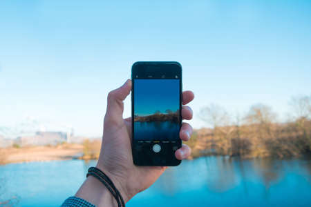 hand, mobile, phone, camera, electronics, gadget, touchscreen, technology, blue, lake, water, view,...