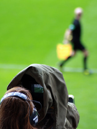 people, woman, man, athlete, videographer, journalist, media, video, headphones, soccer, green