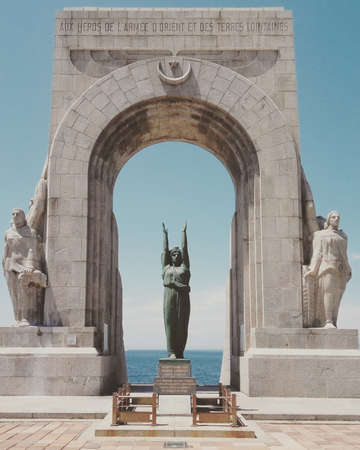 statue, sculpture, monument, gate, arch, landmark, travel, coast, sea, ocean, water, blue, sky