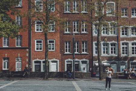 architecture, building, infrastructure, university, city, tree, plant, outdoor, people, sitting,...