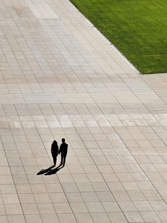 green, grass, field, people, man, woman, couple, walking, holding hands, sunny, day, shadow, outdoor