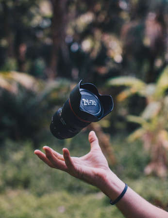 camera, lens, black, hand, palm, bokeh, outdoor, blur, green, grass, nature