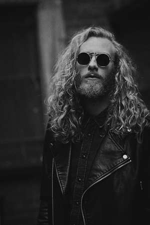 people, man, guy, black, leather, jacket, rock, curly, hair, beard, sunglasses, black and white