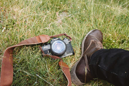 camera, accessory, canon, photography, green, grass, outdoor, travel, shoe, footwear, jeans