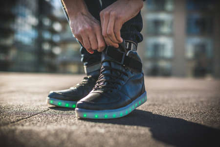 rooftops, sunny, day, shadow, daylight, walking, shoe, footwear, sneakers, fashion, man, guy, hand,...