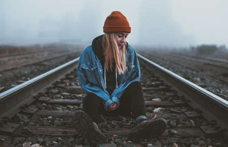 sitting,  train,  train tracks,  tracks,  girl,  blonde,  woman,  lady,  beanie,  cold,  weather, ...