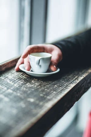 man,  holding,  espresso,  coffee,  cup,  saucer,  window,  ledge,  wood,  drink,  food