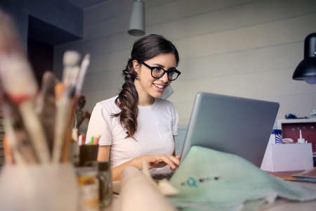 woman,  work,  laptop,  computer,  desk,  office,  smile,  glasses,  art,  paint,  brush,  studio, ...