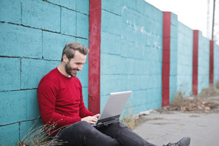 man,  laptop,  smile,  happy,  technology,  computer,  brick,  wall,  blue,  fashion,  red,  jumper,...