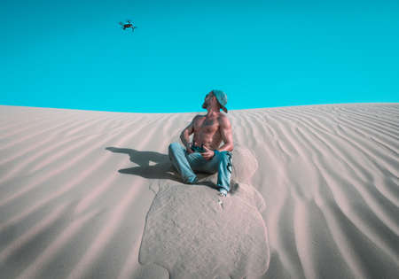 man,  flying,  drone,  camera,  technology,  aerial,  male,  hat,  cap,  sand,  dune,  sand dune, ...