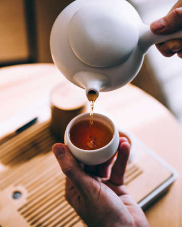 hands,  pouring,  tea,  cup,  close up,  drink,  beverage,  porcelain,  teapot,  morning,  breakfast