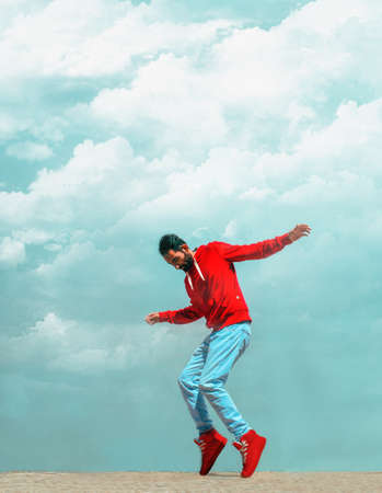 man, casual, dance, red, hoodie, sweatshirt, balance, fun, clouds, pose, portrait, style