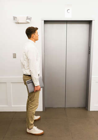 elevator,  building,  person,  waiting,  man,  business,  executive,  city,  ceo,  floor,  laptop, ...
