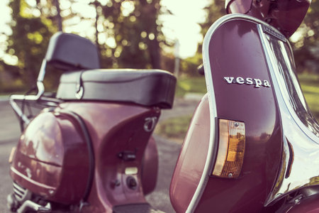 Parked Red Vespa Motor Scooter