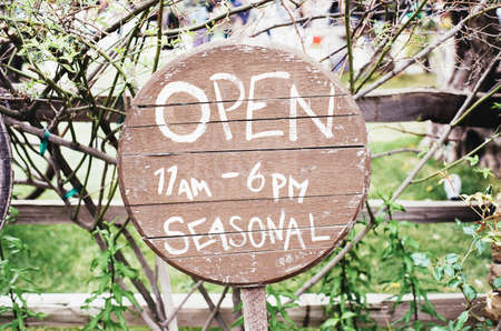 Brown and White Open Signage