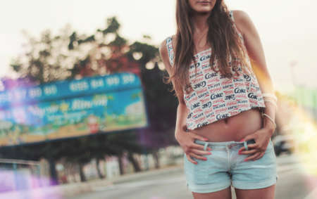 Woman Holding Her Shorts