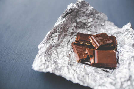 Chocolate pieces on aluminum foil