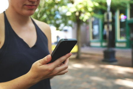 Woman Holding Black Android Smartphone