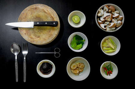 Spices on Bowl Near Knife on Chopping Boad